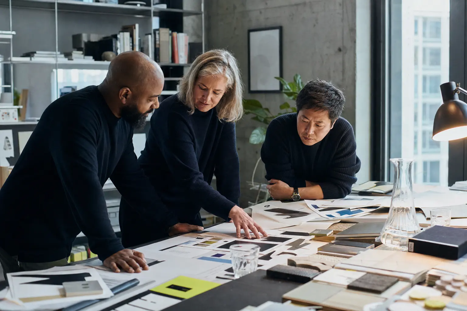 Senior creatives reviewing design directions together in the Growthy studio